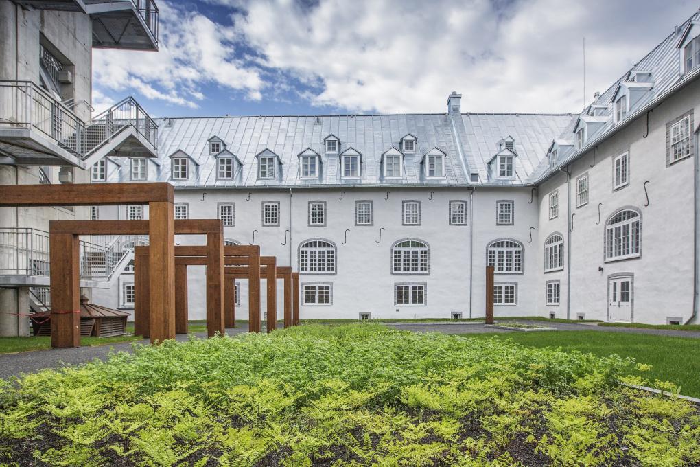 Old wings of the Monastère des Augustine and view of the exterior courtyard.