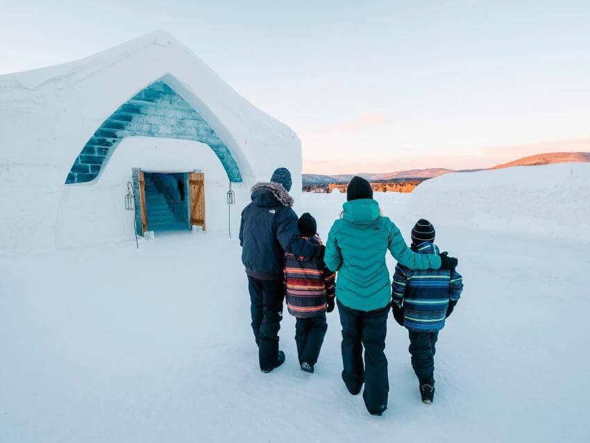 A family entering into the Ice Hotel