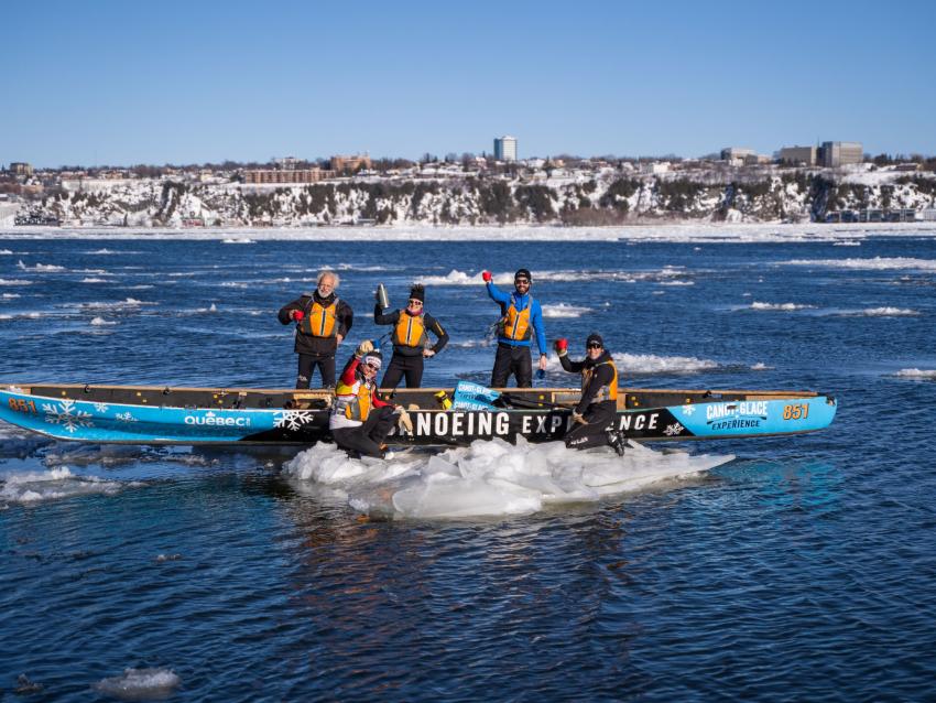 Group in ice canoe on the river