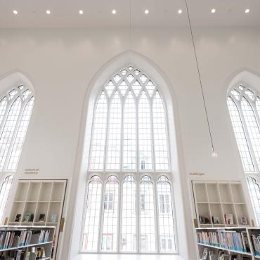 Interior windows of the bright Maison de la Littérature.